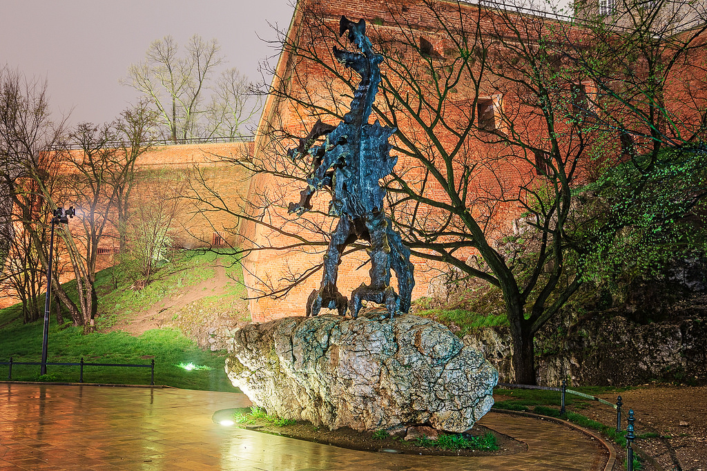 The Wawel Dragon statue in Krakow at night